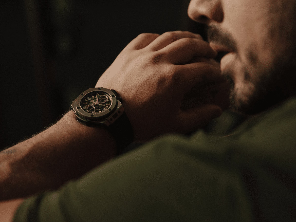 Close up of a man's wrist with a Hublot watch