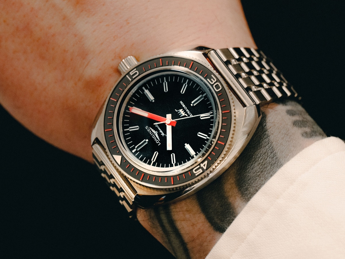 Close up of a man's wrist with a Longines watch