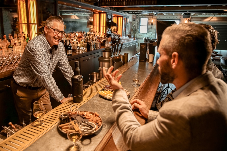 Men in a bar talking to each other